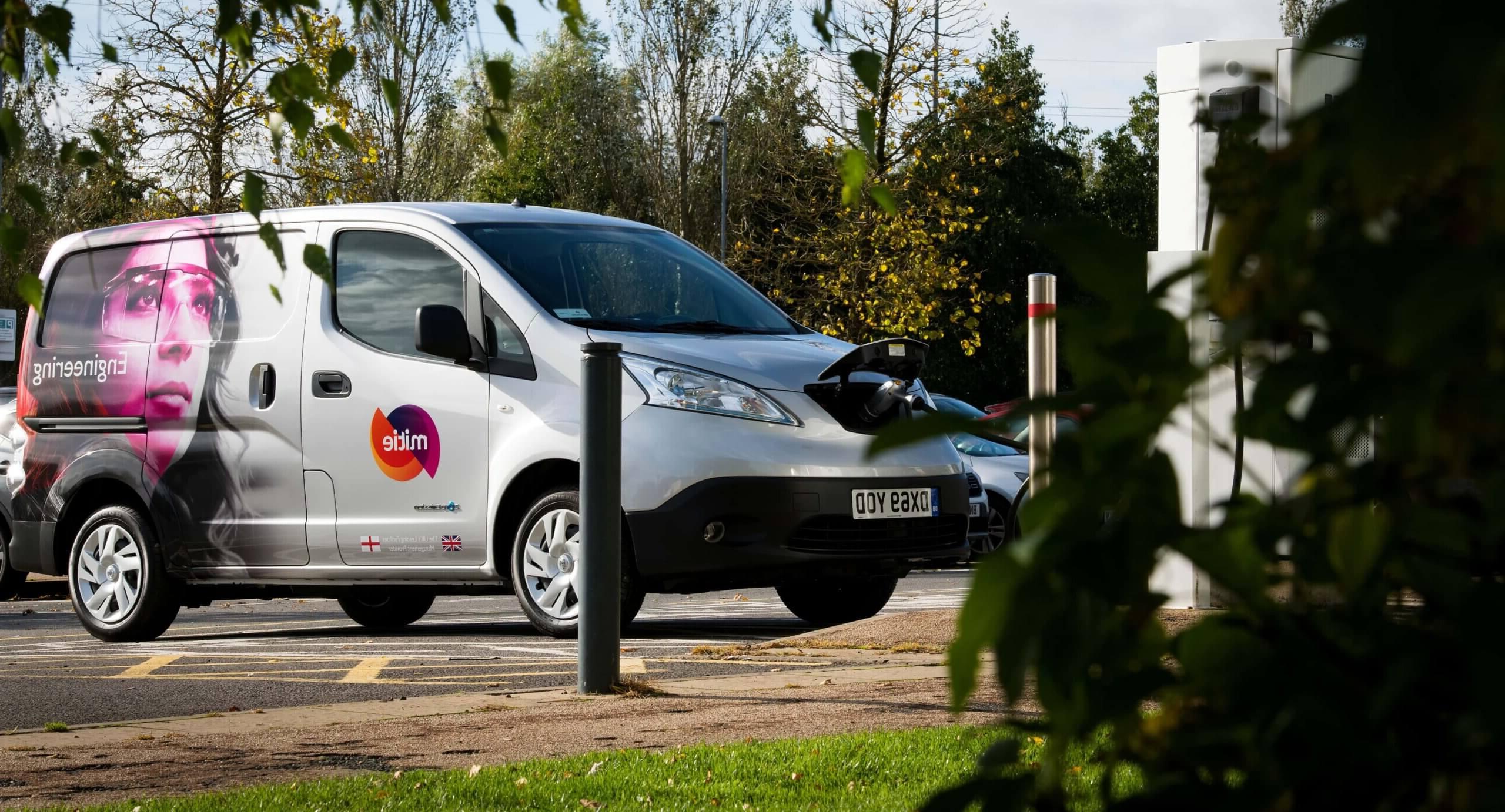 Mitie branded-van plugged into an electric charger